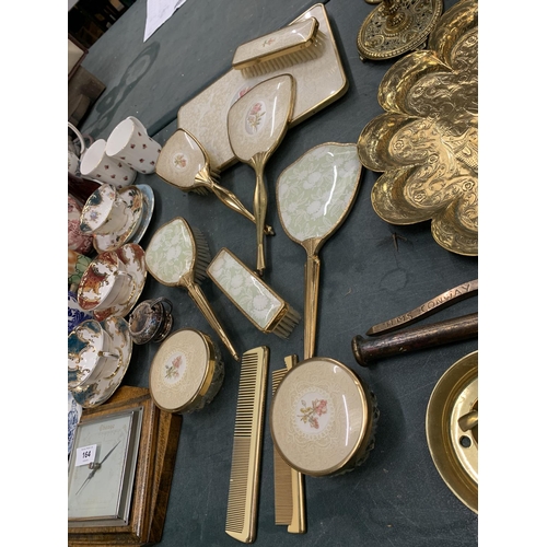 163 - A COLLECTION OF DRESSING TABLE BRUSHES WITH FLORAL DECORATION TO THE BACKS PLUS A TRAY, HAND MIRRORS... 