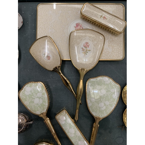 163 - A COLLECTION OF DRESSING TABLE BRUSHES WITH FLORAL DECORATION TO THE BACKS PLUS A TRAY, HAND MIRRORS... 