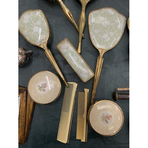 163 - A COLLECTION OF DRESSING TABLE BRUSHES WITH FLORAL DECORATION TO THE BACKS PLUS A TRAY, HAND MIRRORS... 