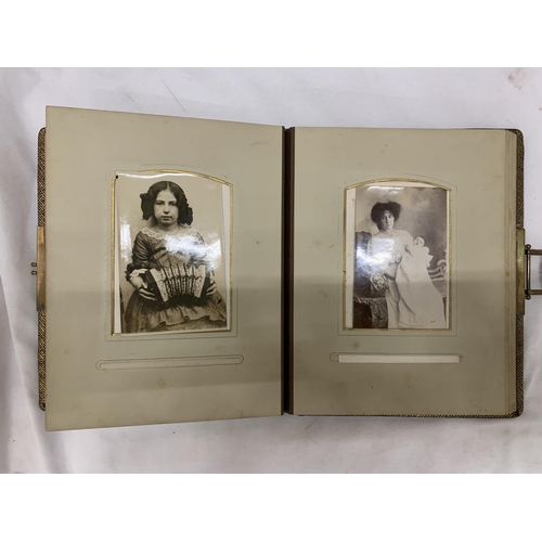 186 - A VICTORIAN LEATHERBOUND PHOTO ALBUM CONTAINING PHOTO'S