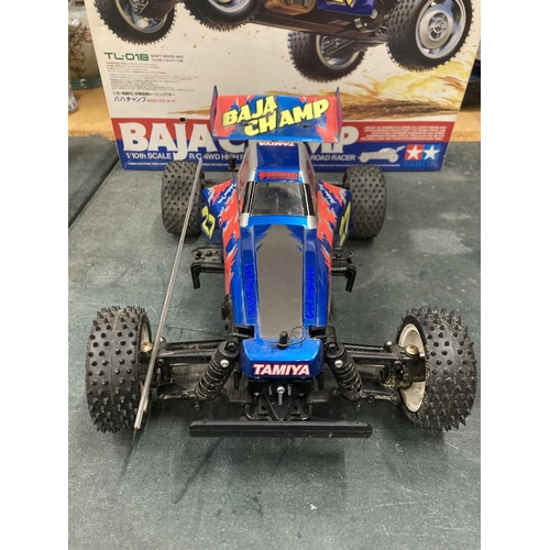 314 - A TAMIYA BAJA CHAMP 1/10TH SCALE R/C 4WD HIGH PERFORMANCE OFF ROAD RACER (NO CONTROLLER PRESENT)