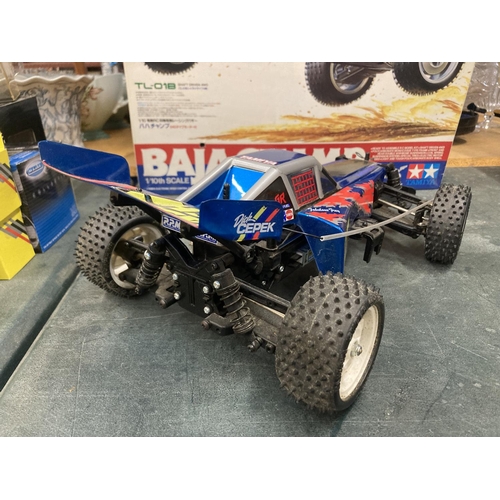 314 - A TAMIYA BAJA CHAMP 1/10TH SCALE R/C 4WD HIGH PERFORMANCE OFF ROAD RACER (NO CONTROLLER PRESENT)