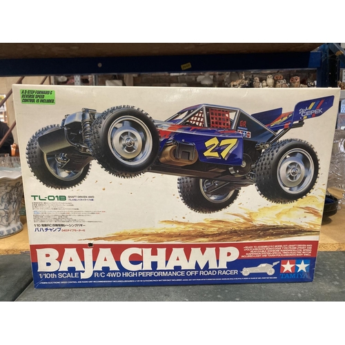 314 - A TAMIYA BAJA CHAMP 1/10TH SCALE R/C 4WD HIGH PERFORMANCE OFF ROAD RACER (NO CONTROLLER PRESENT)