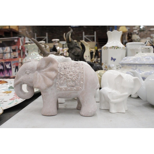 219 - A COLLECTION OF ELEVEN ELEPHANT FIGURES INCLUDING WOODEN AND CERAMIC