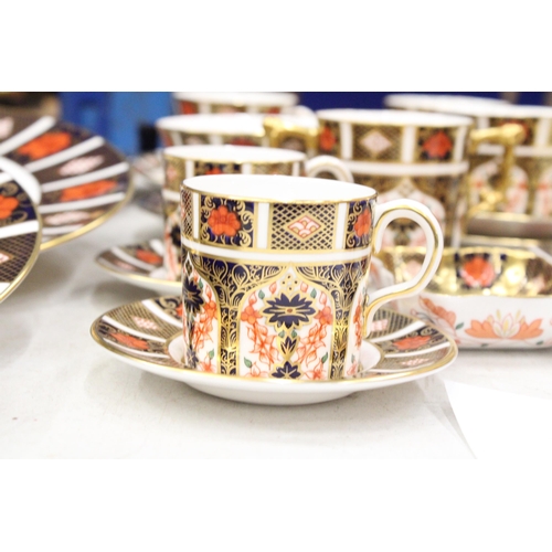 12 - A QUANTITY OF ROYAL CROWN DERBY TO INCLUDE A LOVING CUP , COFFEE CANS AND SAUCERS, TEACUPS AND SAUCE... 