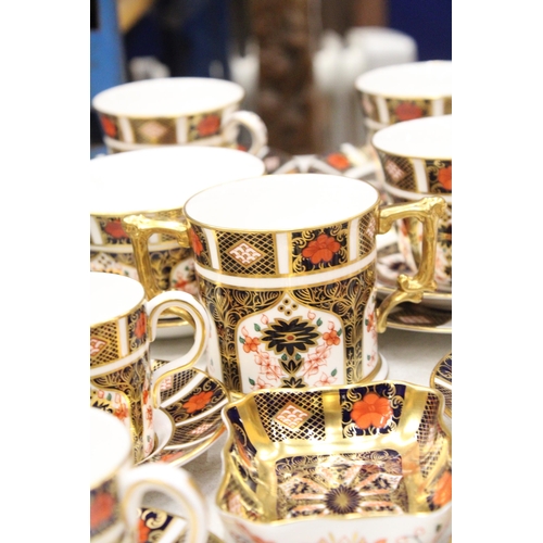 12 - A QUANTITY OF ROYAL CROWN DERBY TO INCLUDE A LOVING CUP , COFFEE CANS AND SAUCERS, TEACUPS AND SAUCE... 