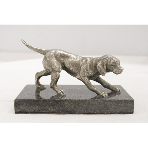 16 - A WHITE METAL DOG ON A MARBLE STAND