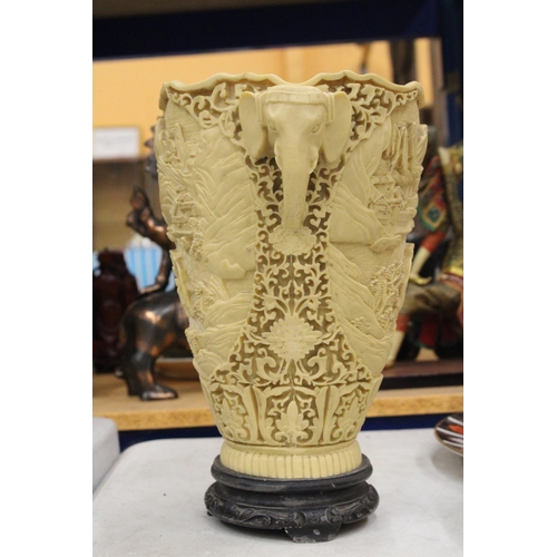 17 - A LARGE CHINESE CARVED RESIN VASE WITH ELEPHANT HANDLES