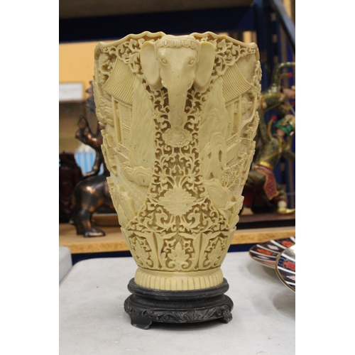 17 - A LARGE CHINESE CARVED RESIN VASE WITH ELEPHANT HANDLES