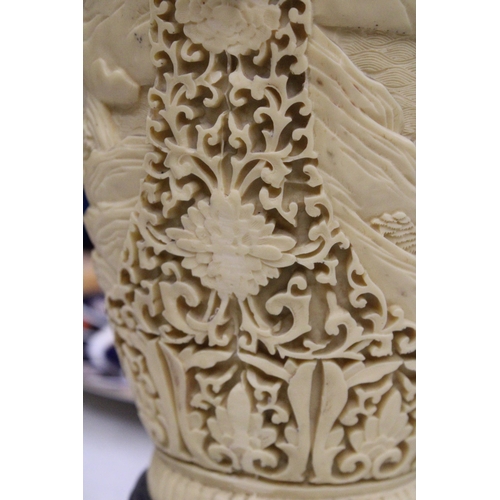 17 - A LARGE CHINESE CARVED RESIN VASE WITH ELEPHANT HANDLES