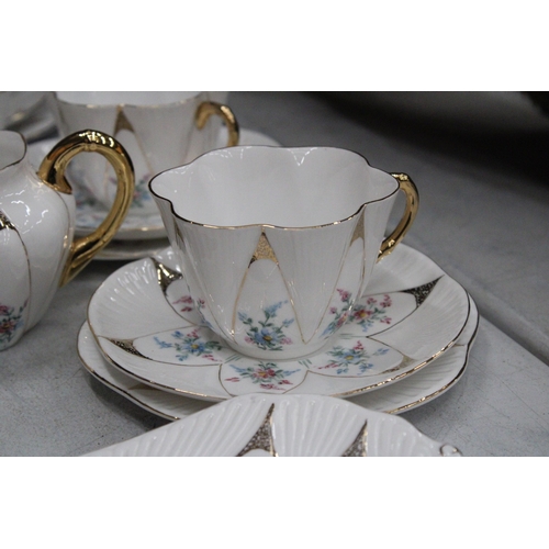 36 - A VINTAGE SHELLEY HANDPAINTED DAINTY SHAPE TEACUPS AND SAUCERS TO INCLUDE SUGAR, CREAMER, CAKE/BREAD... 