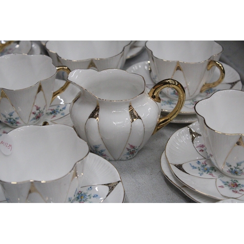 36 - A VINTAGE SHELLEY HANDPAINTED DAINTY SHAPE TEACUPS AND SAUCERS TO INCLUDE SUGAR, CREAMER, CAKE/BREAD... 