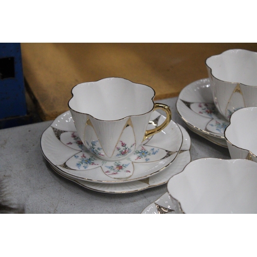 36 - A VINTAGE SHELLEY HANDPAINTED DAINTY SHAPE TEACUPS AND SAUCERS TO INCLUDE SUGAR, CREAMER, CAKE/BREAD... 