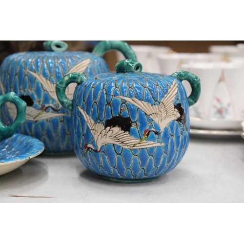 42 - A JAPANESE SATSUMA BLUE MORRIAGE CRANE TEAPOT, LIDDED SUGAR BOWL AND TEACUP AND SAUCER