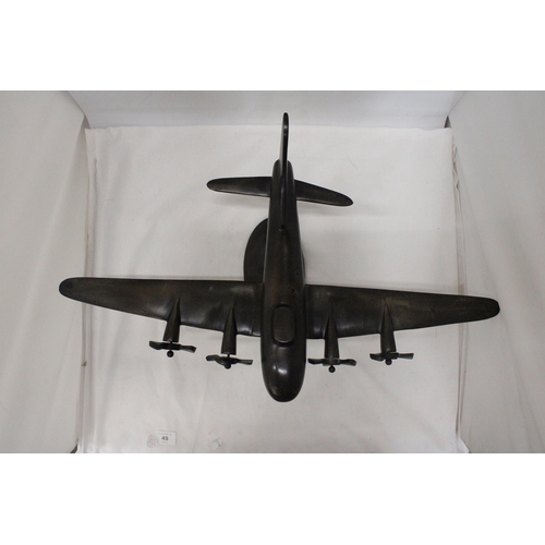 49 - A HEAVY METAL ART DECO STYLE BOMBER ON METAL PLINTH - 59 CM X 43 X 28