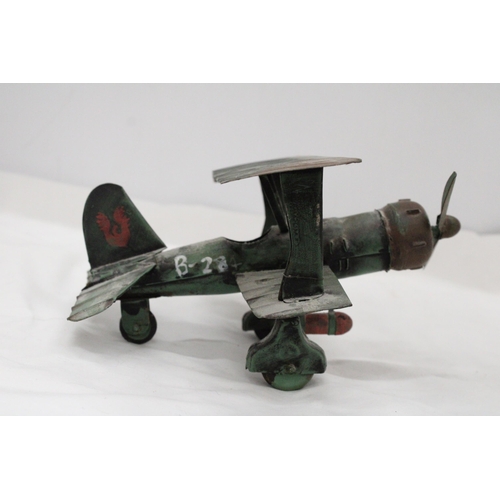 195 - A U.S.A TIN PLATE BI-PLANE APPROXIMATELY 13CM HIGH BY 23CM LONG