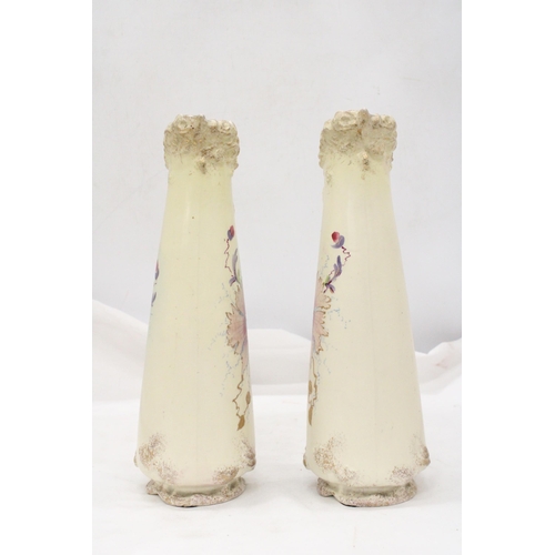 229 - A PAIR OF VICTORIAN JUGS IN IVORY WITH FLORAL AND GILT DECORATION - APPROXIMATELY 31CM HIGH