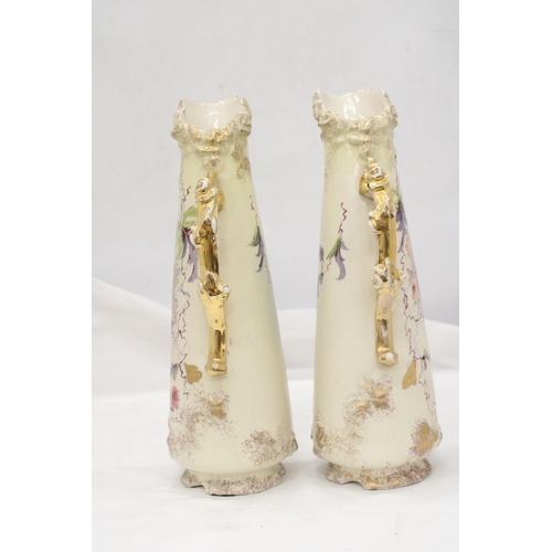 229 - A PAIR OF VICTORIAN JUGS IN IVORY WITH FLORAL AND GILT DECORATION - APPROXIMATELY 31CM HIGH