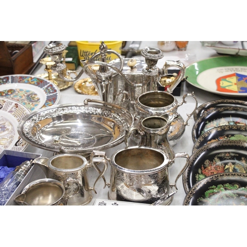 250A - A MIXED LOT OF SILVER PLATE TO INCLUDE A TEAPOT, JUGS, CANDELABRA ETC