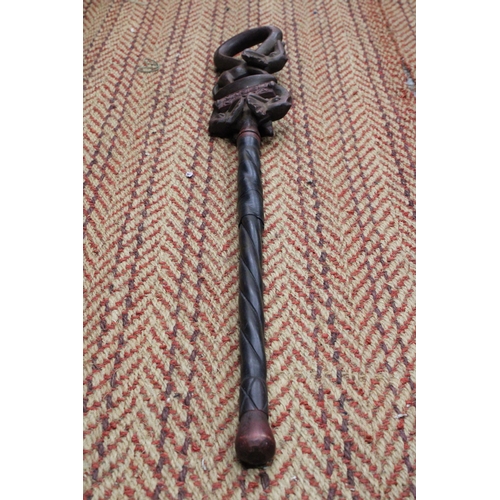 264 - A HAND CARVED AFRICAN WALKING STICK, WITH ELEPHANT FIGURES TO THE TOP, WITH THE INSCRIPTION 'KARIBU,... 