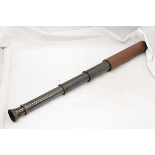 267 - A VINTAGE LEATHER BOUND TWO DRAW TELESCOPE