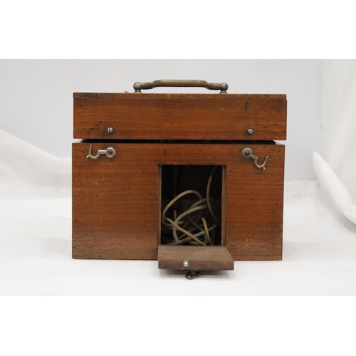 271 - A VINTAGE ELECTRONIC MEDICAL APPLIANCE - IN OAK CASE