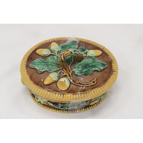 276 - A MAJOLICA, OVAL, LIDDED POT, WITH OAK LEAF AND ACORN DECORATION