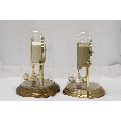 280 - TWO BRASS ANNIVERSARY CLOCKS WITH GLASS DOMES