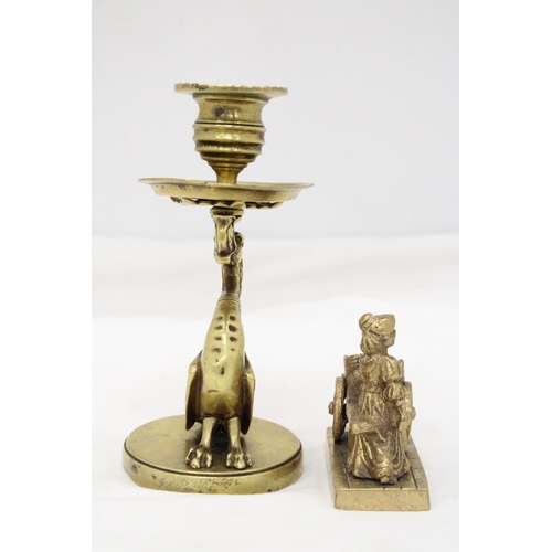 289 - A VINTAGE BRASS GRYPHON CANDLESTICK PLUS A MOLLY MALONE FIGURE