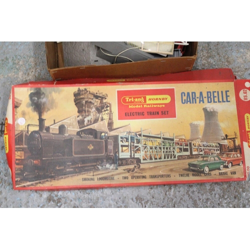 485A - A VINTAGE TRI-ANG HORNBY, CAR-A-BELLE ELECTRIC TRAIN SET PLUS A QUANTITY OF ACCESSORIES