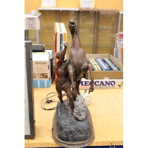 68 - A HEAVY FRENCH METAL HORSE AND MAN ON WOODEN BASE 