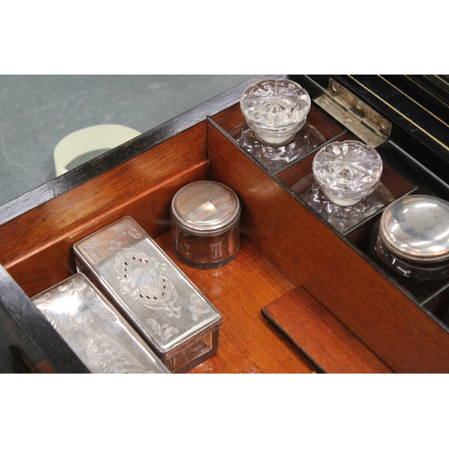 85 - A VINTAGE MAHOGANY CASED WRITING BOX WITH A SECRET DRAWER TO INCLUDE INKWELLS, AND SILVER PLATED LID... 