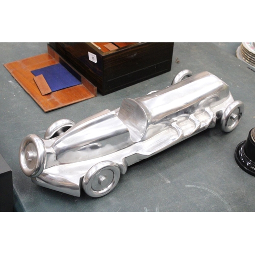 86 - A LARGE CHROME ART DECO RACING CAR, LENGTH APPROX 55CM