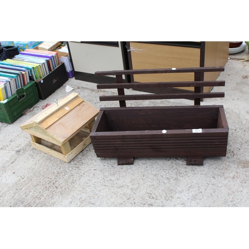 1875 - A WOODEN TROUGH PLANTER AND A WOODEN BIRD TABLE TOP