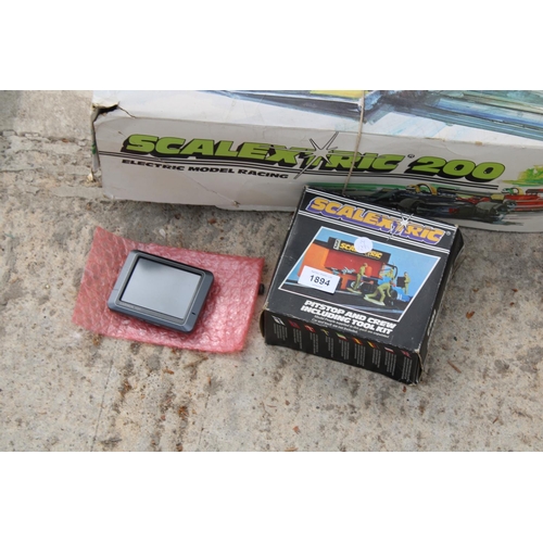 1894 - A SCALETRIX 200 MODEL RACING SET, A SCALETRIX PITSTOP AND CREW AND A GARMIN SATNAV