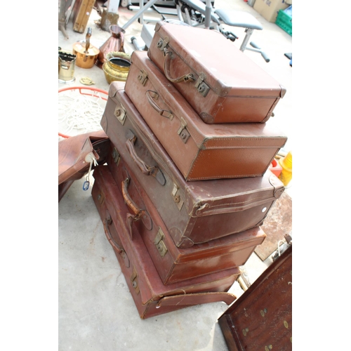 1904 - FIVE VINTAGE LEATHER TRAVEL CASES AND A LEATHER BAG