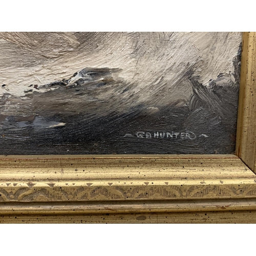 37 - AN OIL ON BOARD OF A STORM AT SEA IN AN ORNATE GOLD FRAME SIGNED G A HUNTER