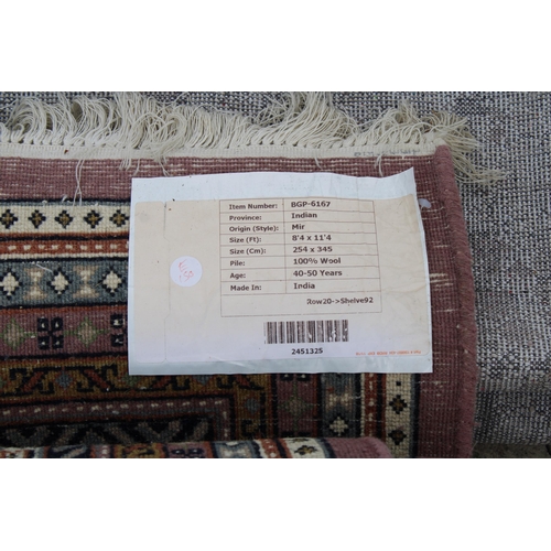 A BELIEVED AS NEW MADE IN INDIA RED PATTERNED RUG (254CM x345CM)