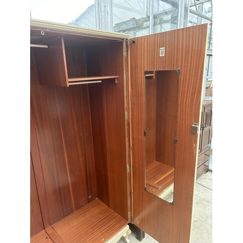 3109 - A CREAM AND GILT 'WALNUT CABINET WORKS' (LONDON) TWO DOOR WARDROBE ON CABRIOLE LEGS, 49