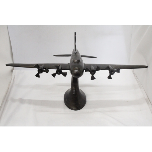 49 - A HEAVY METAL ART DECO STYLE MODEL OD A FOUR PROP AIRCRAFT ON METAL PLINTH - 59 CM X 43 X 28