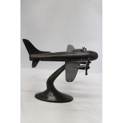 49 - A HEAVY METAL ART DECO STYLE MODEL OD A FOUR PROP AIRCRAFT ON METAL PLINTH - 59 CM X 43 X 28