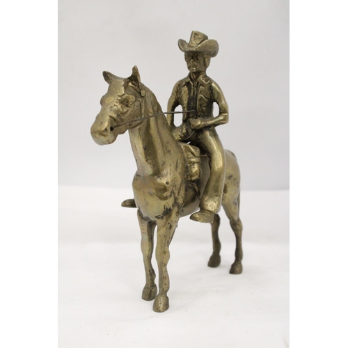 112 - AN UNUSUAL SOLID BRASS COWBOY AND HORSE - APPROXIMATELY 22CM X 22CM - WEIGHS OVER TWO KILO