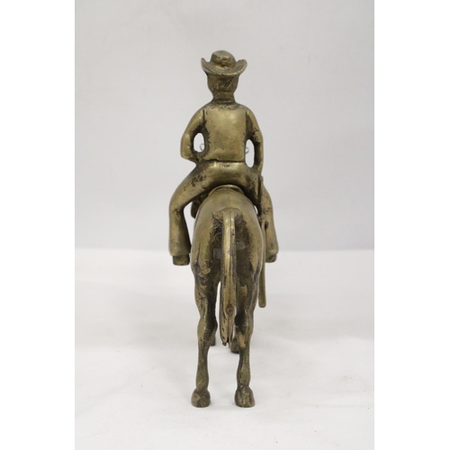 112 - AN UNUSUAL SOLID BRASS COWBOY AND HORSE - APPROXIMATELY 22CM X 22CM - WEIGHS OVER TWO KILO