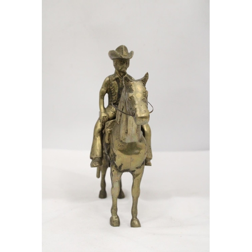 112 - AN UNUSUAL SOLID BRASS COWBOY AND HORSE - APPROXIMATELY 22CM X 22CM - WEIGHS OVER TWO KILO