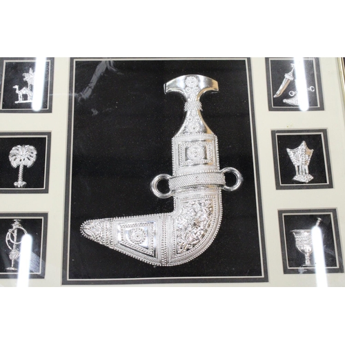 133 - A BOXED AND GLAZED SILVERED ARTEFACTS FROM MUSCAT, OMAN - 17 X 17 INCH