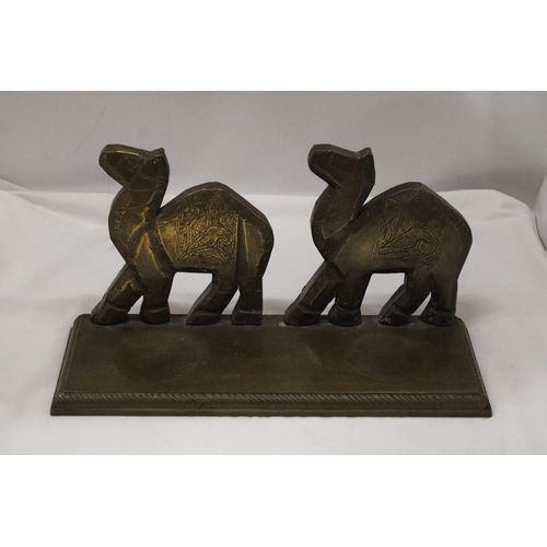 134 - A BRASS CAMEL'S STAND 15 X 8 INCH