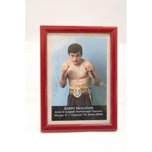 143 - A SIGNED FRAMED PHOTOGRAPH OF BARRY McGUIGAN, PLUS A JOHN CONTEH SIGNATURE