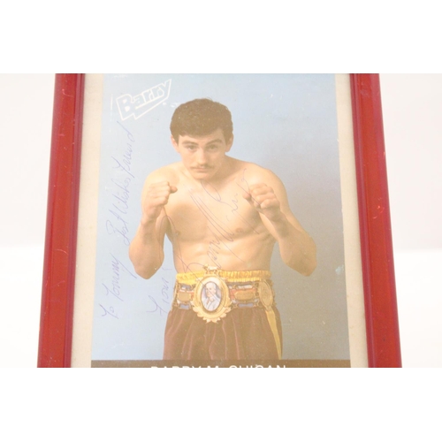 143 - A SIGNED FRAMED PHOTOGRAPH OF BARRY McGUIGAN, PLUS A JOHN CONTEH SIGNATURE