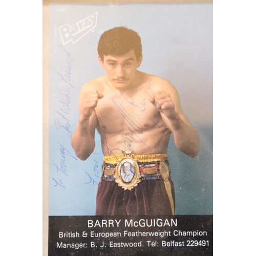 143 - A SIGNED FRAMED PHOTOGRAPH OF BARRY McGUIGAN, PLUS A JOHN CONTEH SIGNATURE