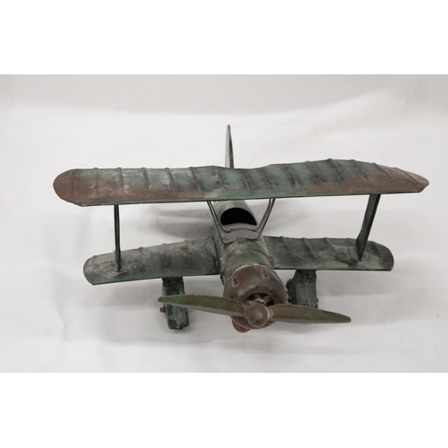 195 - A U.S.A TIN PLATE BI-PLANE APPROXIMATELY 13CM HIGH BY 23CM LONG